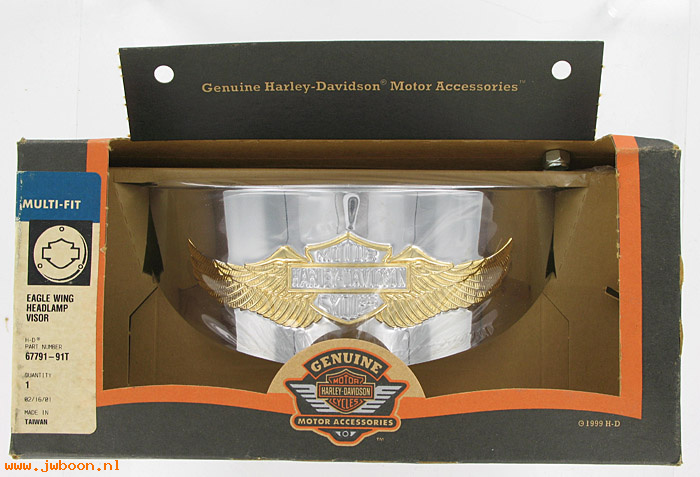   67791-91T (67791-91T): Headlamp visor,7" headlight-gold Eagle Wing logo "Eagle Iron"-NOS