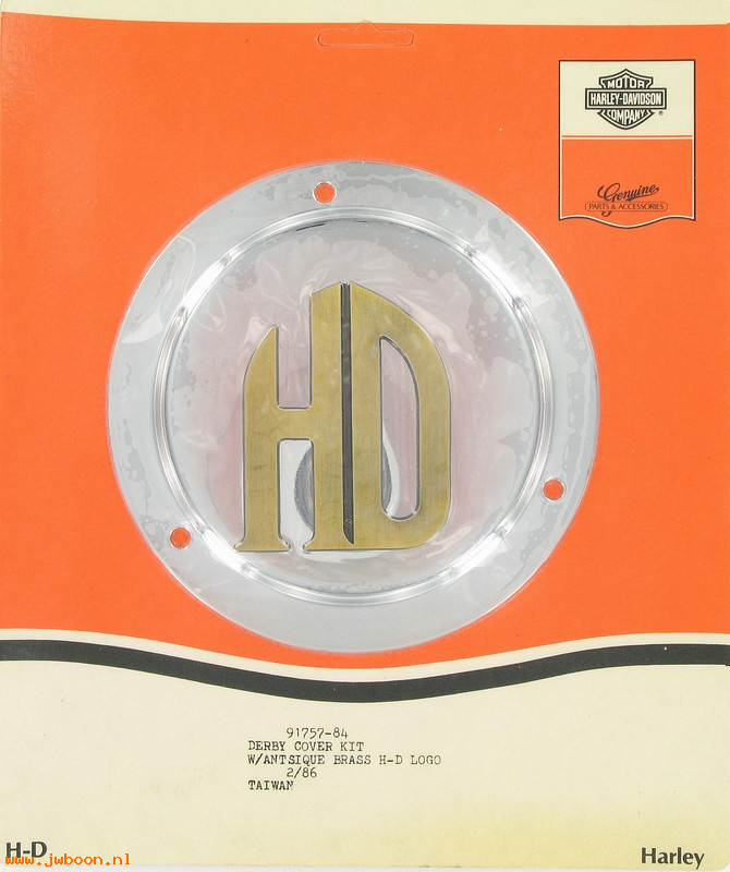   91757-84 (91757-84): Derby cover kit w. antique brass H-D logo - NOS - Big Twins 70-99